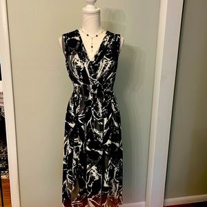 Lovely v-neck faux wrap style nylon chiffon dress has invisible back zipper.